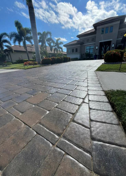 Close-up of sealed pavers with a premium wet-look finish on a Sarasota driveway.